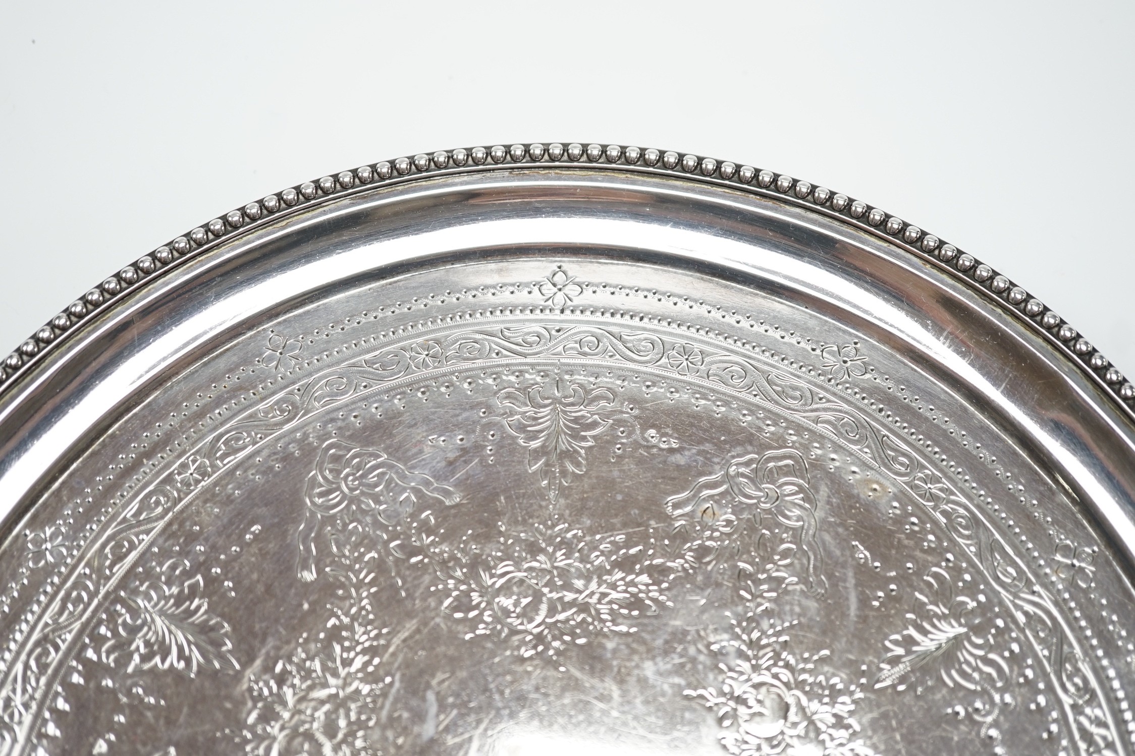 A Victorian engraved silver circular salver, Edward Charles Brown, London, 1875, 25.7cm, 18.8oz.